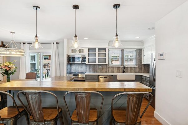 Dining room, Interior, Kitchen, Pendant Lights, Recessed Lighting, Stainless Steel Appliances, Wood Texture Flooring