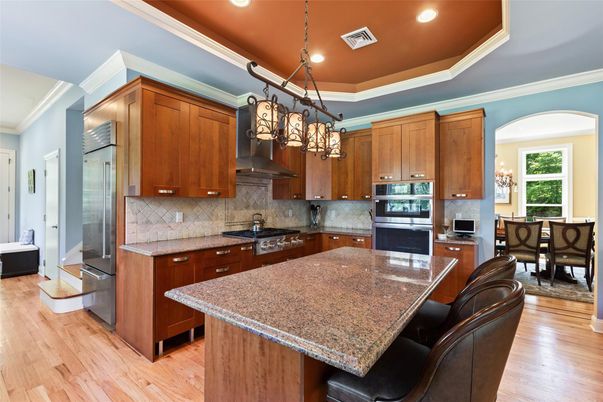 Dining room, Interior, Kitchen, Pendant Lights, Recessed Lighting, Stainless Steel Appliances, Wood Texture Flooring