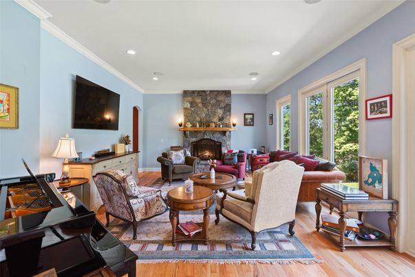 Fireplace, Interior, Living room, Recessed Lighting, Stone Walls, Wood Texture Flooring