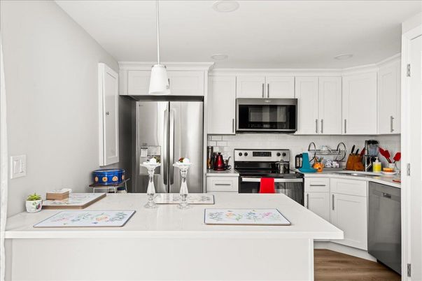 Interior, Kitchen, Pendant Lights, Recessed Lighting, Stainless Steel Appliances, Wood Texture Flooring