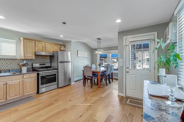 Dining room, Interior, Kitchen, Pendant Lights, Recessed Lighting, Stainless Steel Appliances, Wood Texture Flooring