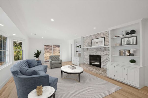 Fireplace, Interior, Living room, Recessed Lighting, Stone Walls, Wood Texture Flooring