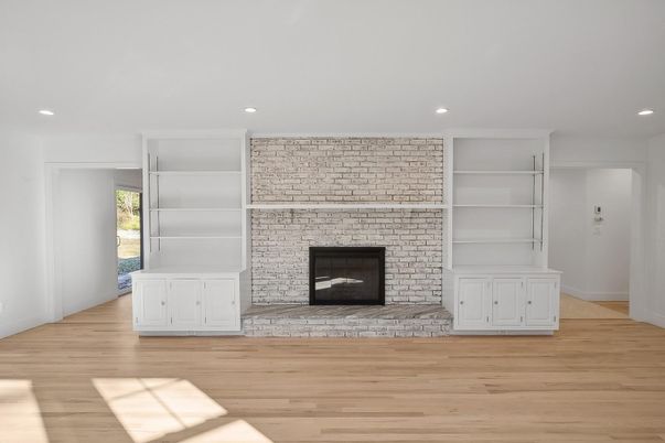 Empty room, Fireplace, Interior, Recessed Lighting, Stone Walls, Wood Texture Flooring
