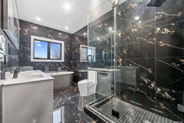 Bathroom, Free Standing Baths, Glass Shower, Interior, Marble, Marble Walls, Recessed Lighting