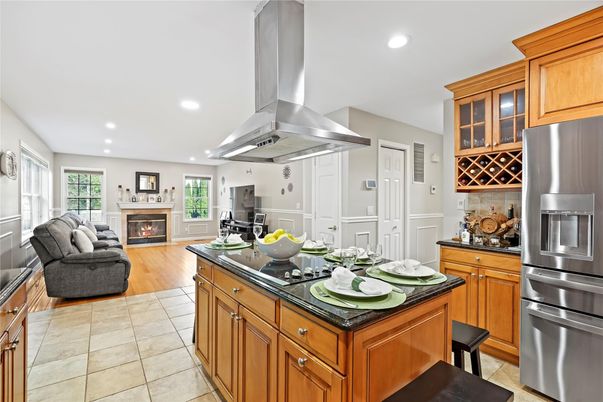 Fireplace, Interior, Kitchen, Living room, Recessed Lighting, Stainless Steel Appliances, Wood Texture Flooring