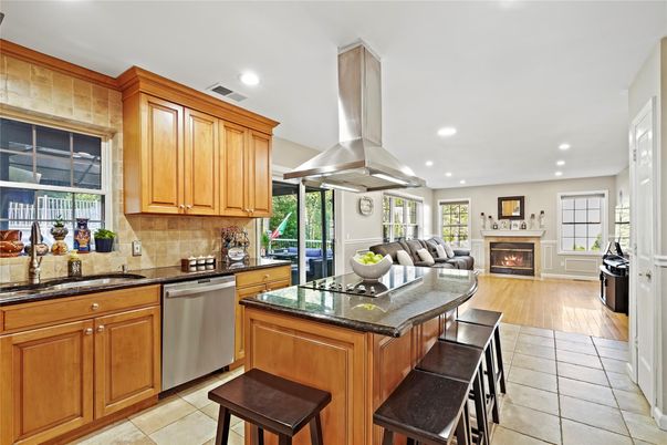 Fireplace, Interior, Kitchen, Living room, Recessed Lighting, Stainless Steel Appliances, Wood Texture Flooring