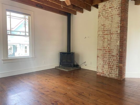 Empty room, Fireplace, Interior, Stone Walls, Wooden Beams, Wood Texture Flooring
