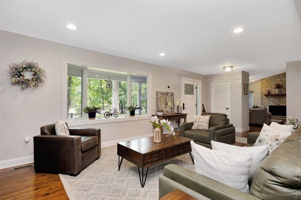 Fireplace, Interior, Living room, Recessed Lighting, Stone Walls, Wood Texture Flooring