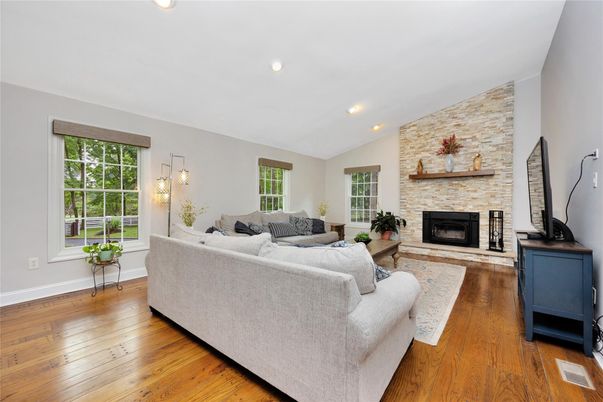 Fireplace, Interior, Living room, Pendant Lights, Recessed Lighting, Stone Walls, Wood Texture Flooring