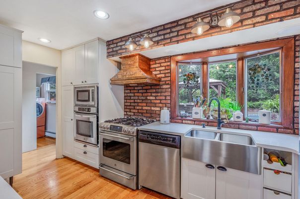 Interior, Kitchen, Recessed Lighting, Stainless Steel Appliances, Washer, Wood Texture Flooring