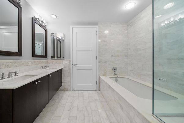 Bathroom, Dual Sink Vanities, Glass Shower, Interior, Marble, Marble Walls, Recessed Lighting