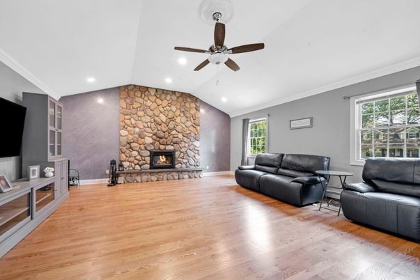 Fireplace, Interior, Living room, Recessed Lighting, Stone Walls, Wood Texture Flooring