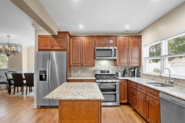Chandelier, Dining room, Interior, Kitchen, Recessed Lighting, Stainless Steel Appliances, Wood Texture Flooring