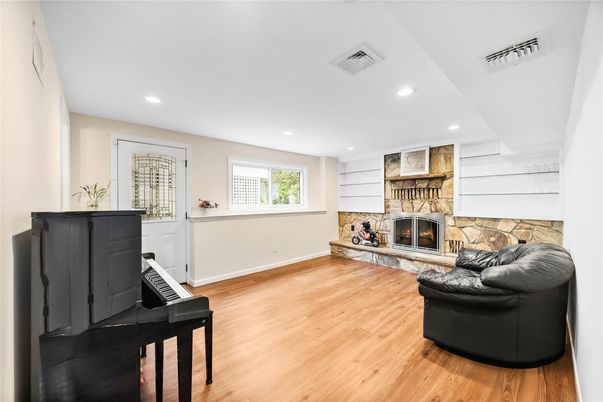 Fireplace, Interior, Piano, Recessed Lighting, Stone Walls, Wood Texture Flooring