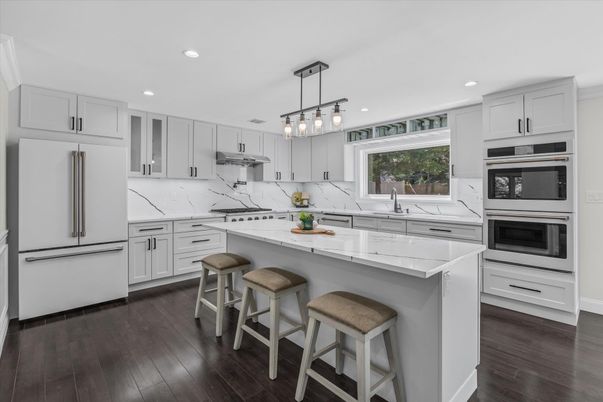 Interior, Kitchen, Marble Walls, Pendant Lights, Recessed Lighting, Stainless Steel Appliances, Wood Texture Flooring
