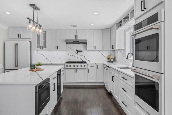 Interior, Kitchen, Marble Walls, Pendant Lights, Recessed Lighting, Stainless Steel Appliances, Wood Texture Flooring