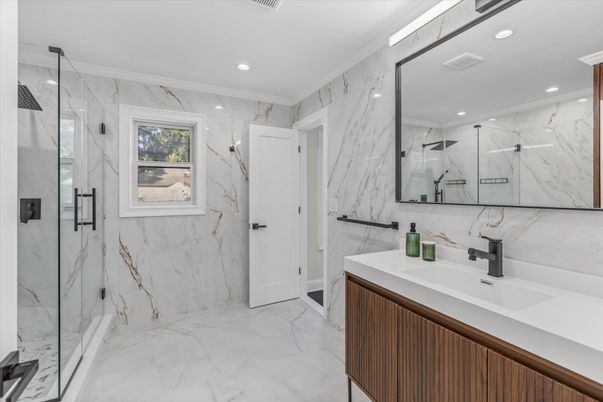 Bathroom, Dual Sink Vanities, Glass Shower, Interior, Marble, Marble Walls, Recessed Lighting