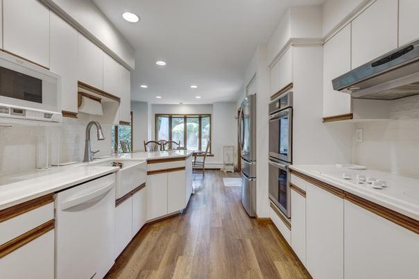 Dining room, Interior, Kitchen, Recessed Lighting, Stainless Steel Appliances, Wood Texture Flooring