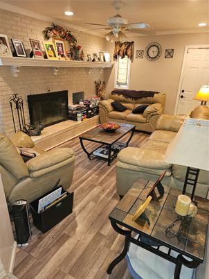 Fireplace, Interior, Living room, Recessed Lighting, Stone Walls, Wood Texture Flooring