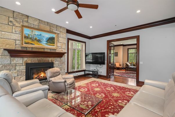 Fireplace, Interior, Living room, Recessed Lighting, Stone Walls, Wood Texture Flooring
