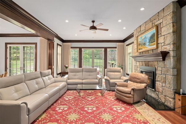Fireplace, Interior, Living room, Recessed Lighting, Stone Walls, Wood Texture Flooring