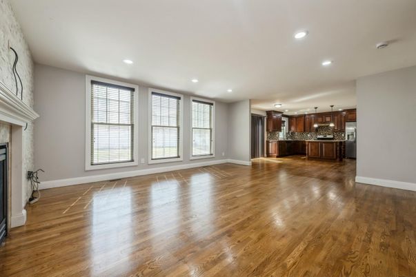 Empty room, Fireplace, Interior, Kitchen, Recessed Lighting, Wood Texture Flooring