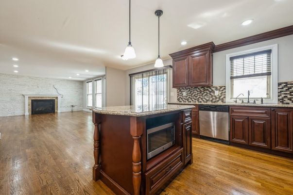 Fireplace, Interior, Kitchen, Pendant Lights, Recessed Lighting, Stone Walls, Wood Texture Flooring