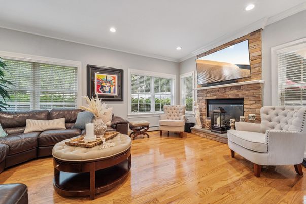 Fireplace, Interior, Living room, Recessed Lighting, Stone Walls, Wood Texture Flooring