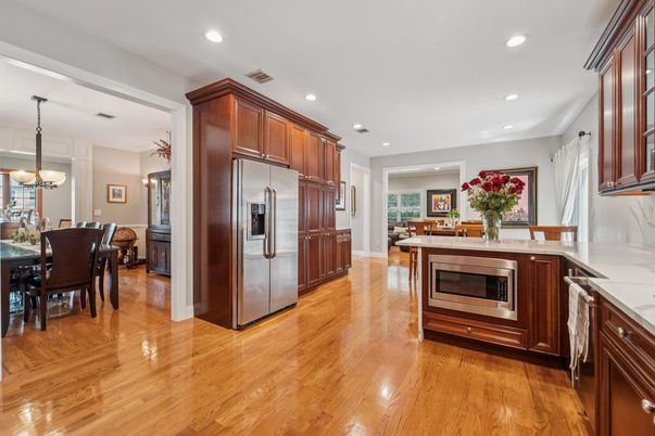 Chandelier, Dining room, Interior, Kitchen, Recessed Lighting, Stainless Steel Appliances, Wood Texture Flooring