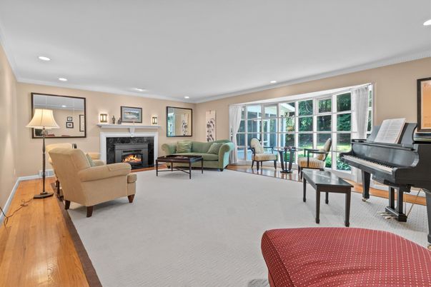 Fireplace, Interior, Living room, Piano, Recessed Lighting, Wood Texture Flooring