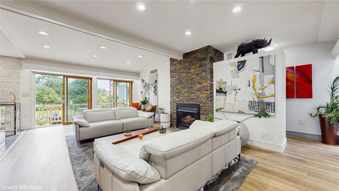 Fireplace, Interior, Living room, Recessed Lighting, Stone Walls, Wood Texture Flooring