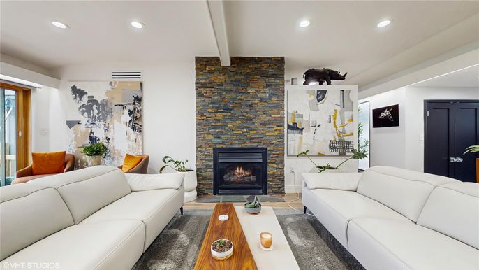 Fireplace, Interior, Living room, Recessed Lighting, Stone Walls, Wood Texture Flooring