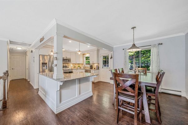 Dining room, Interior, Kitchen, Pendant Lights, Recessed Lighting, Stainless Steel Appliances, Wood Texture Flooring