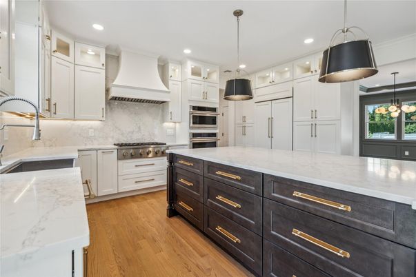 Interior, Kitchen, Marble Walls, Pendant Lights, Recessed Lighting, Stainless Steel Appliances, Wood Texture Flooring