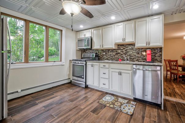 Dining room, Interior, Kitchen, Recessed Lighting, Stainless Steel Appliances, Wood Texture Flooring