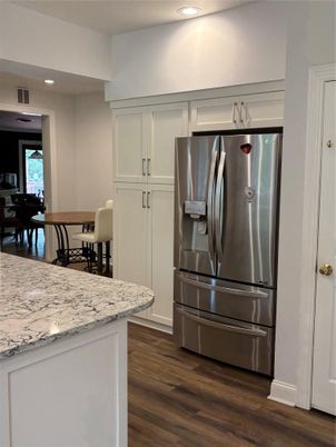 Dining room, Interior, Kitchen, Recessed Lighting, Stainless Steel Appliances, Wood Texture Flooring