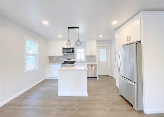 Interior, Kitchen, Pendant Lights, Recessed Lighting, Stainless Steel Appliances, Wood Texture Flooring