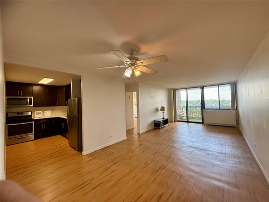 Empty room, Interior, Kitchen, Stainless Steel Appliances, Wood Texture Flooring
