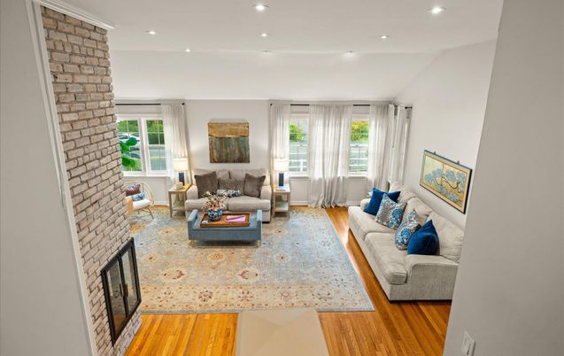 Fireplace, Interior, Living room, Recessed Lighting, Stone Walls, Wood Texture Flooring
