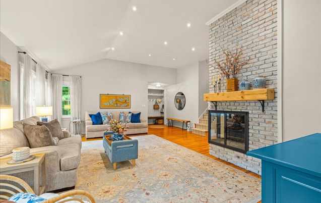 Fireplace, Interior, Living room, Recessed Lighting, Stone Walls, Wood Texture Flooring