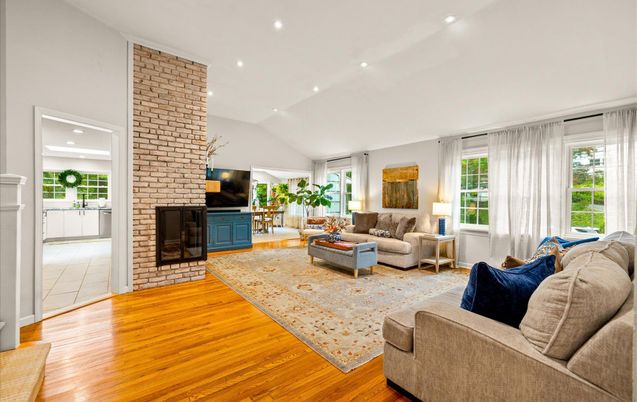 Fireplace, Interior, Living room, Recessed Lighting, Stone Walls, Wood Texture Flooring