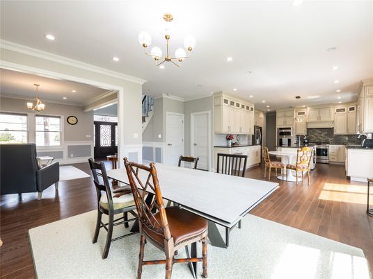 Chandelier, Dining room, Interior, Kitchen, Living room, Pendant Lights, Recessed Lighting, Stainless Steel Appliances, Wood Texture Flooring