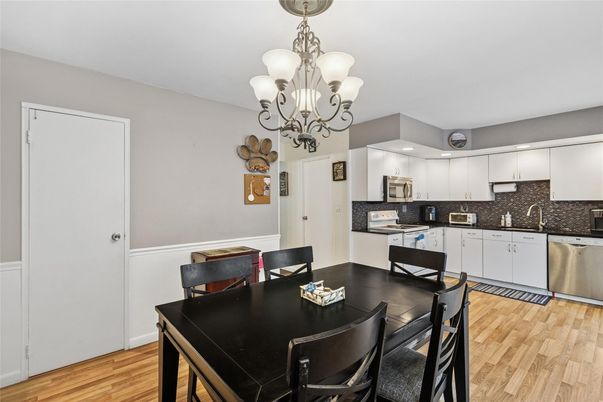Chandelier, Dining room, Interior, Kitchen, Stainless Steel Appliances, Wood Texture Flooring