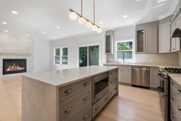 Fireplace, Interior, Kitchen, Pendant Lights, Recessed Lighting, Stainless Steel Appliances, Wood Texture Flooring