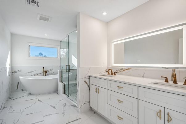 Bathroom, Dual Sink Vanities, Free Standing Baths, Glass Shower, Interior, Marble, Marble Walls, Recessed Lighting