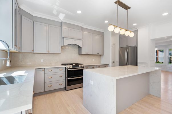 Interior, Kitchen, Marble Walls, Pendant Lights, Recessed Lighting, Stainless Steel Appliances, Wood Texture Flooring