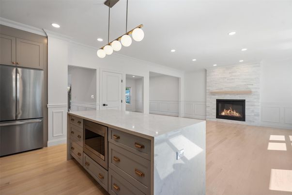 Fireplace, Interior, Kitchen, Pendant Lights, Recessed Lighting, Stainless Steel Appliances, Wood Texture Flooring