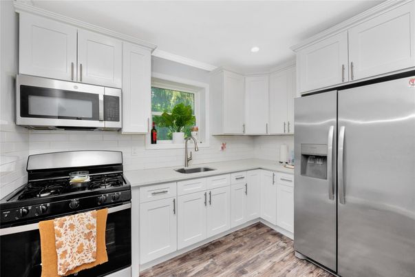Interior, Kitchen, Recessed Lighting, Stainless Steel Appliances, Wood Texture Flooring