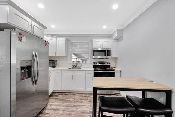 Interior, Kitchen, Recessed Lighting, Stainless Steel Appliances, Wood Texture Flooring