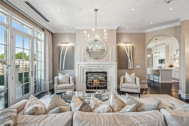 Chandelier, Fireplace, Interior, Kitchen, Living room, Pendant Lights, Recessed Lighting, Stainless Steel Appliances, Wood Texture Flooring